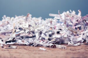 A large pile of shredded paper on table. 