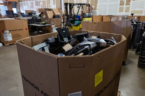Collection of recycled electronics and e-waste, including computers, monitors, and devices prepared for secure electronics recycling and data destruction.
